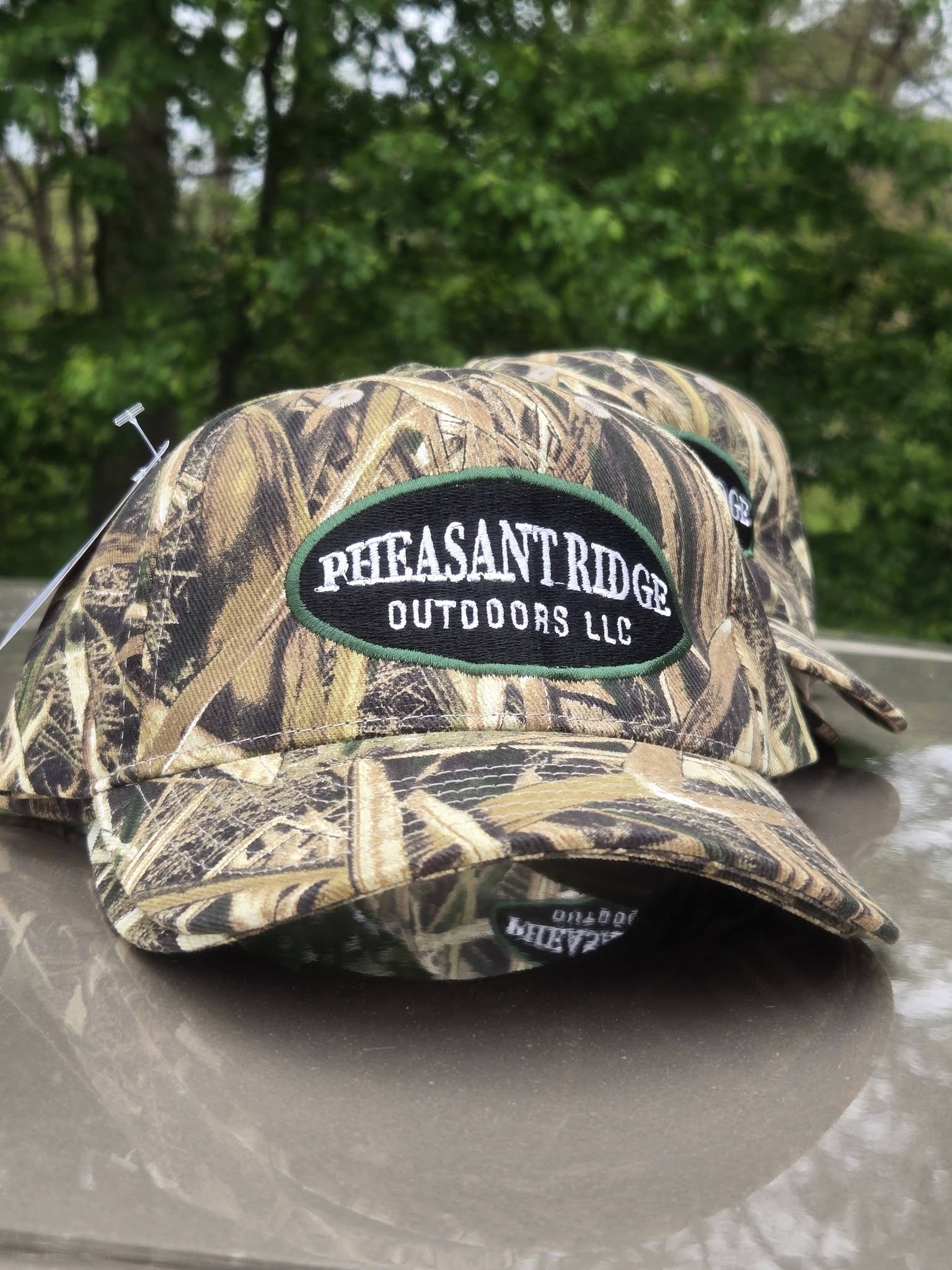 camouflage hat with green and black embroidered outdoor logo 